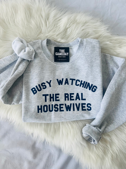 Busy Watching The Real Housewives